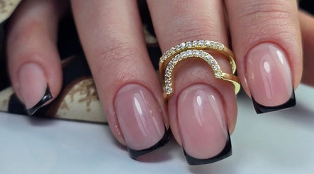 Stylish manicured nails with black tips at SWorld Nails in Kingston Upon Hull, Anglia, GB.