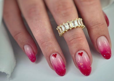 Elegant red ombre nails with hearts at SWorld Nails, Kingston Upon Hull, Anglia, GB.
