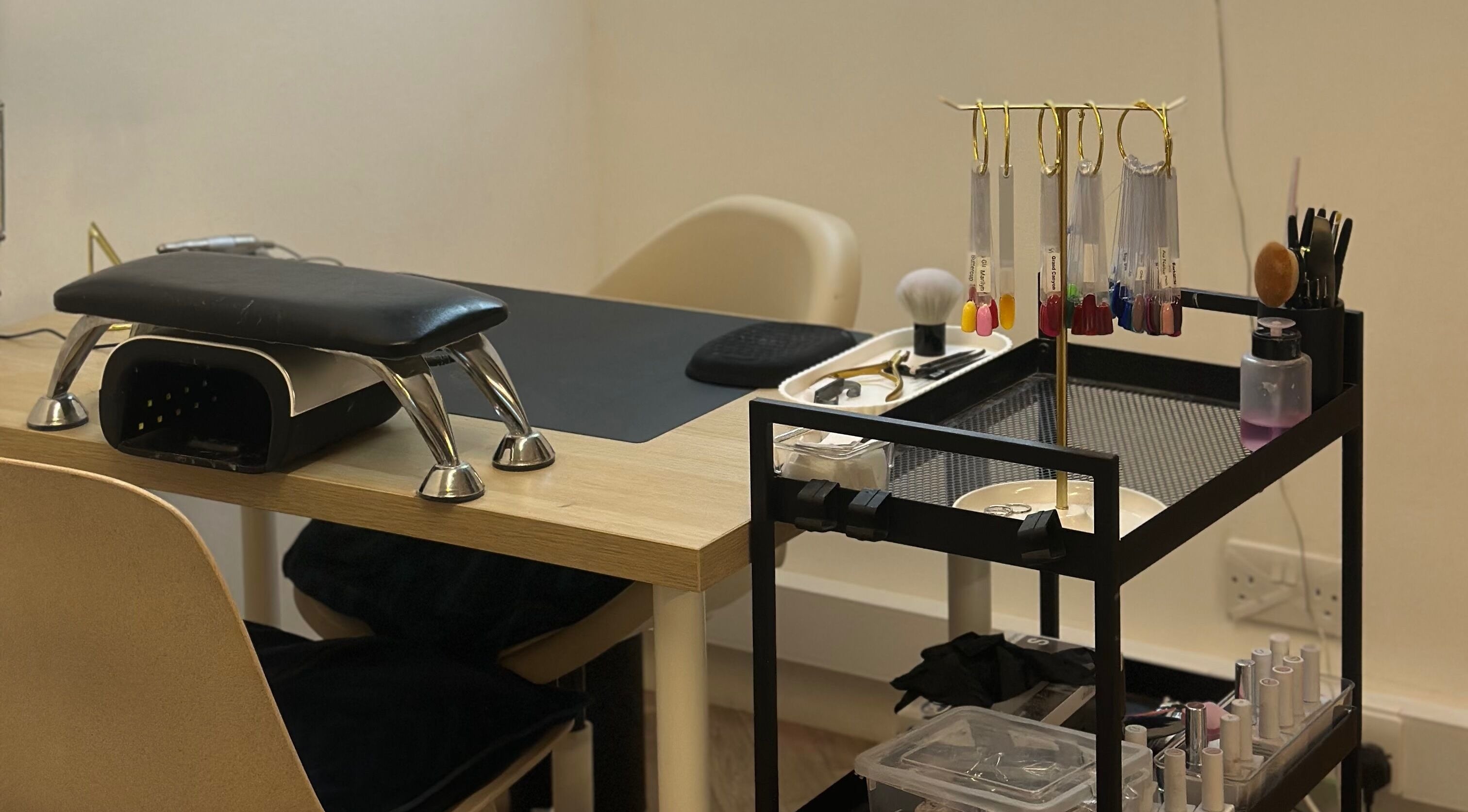 Nail station at Serenity Beauty & Hair Salon in Lerwick, Scotland, GB, with polish and tools for a perfect manicure.