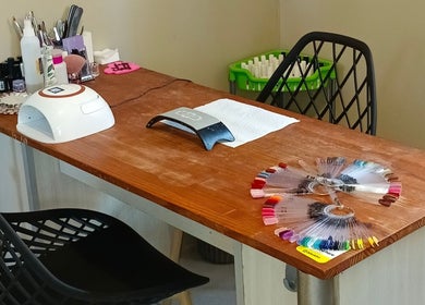 Sakura Beauty by Tarryn's manicure station in East London, Eastern Cape, ZA showcases nail polish colors.