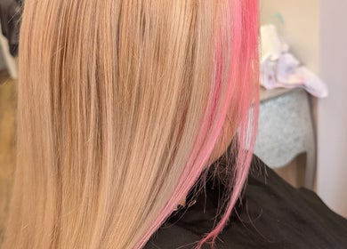 Stylish pink highlights on blonde hair at Twisted Friction @ Strands Studio, Sheffield, England, GB.