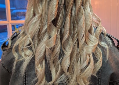 Blonde curls styled at Twisted Friction @ Strands Studio, Sheffield, England, GB, showcasing salon expertise.