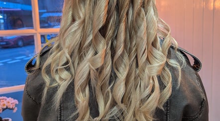 Blonde curls styled at Twisted Friction @ Strands Studio, Sheffield, England, GB, showcasing salon expertise.