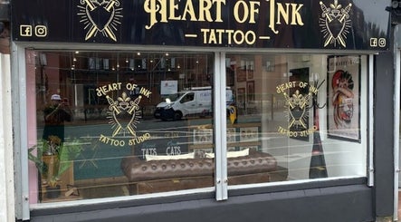 Loz The Hat Tattoo And Piercing's artistic windowfront in Ashton-in-Makerfield, England displays their unique style.