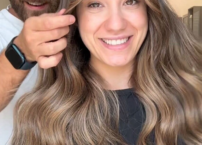 Stylist creating a wavy hairstyle at Salon Charles Malek in Naqqache, Jabal Lubnan, LB.