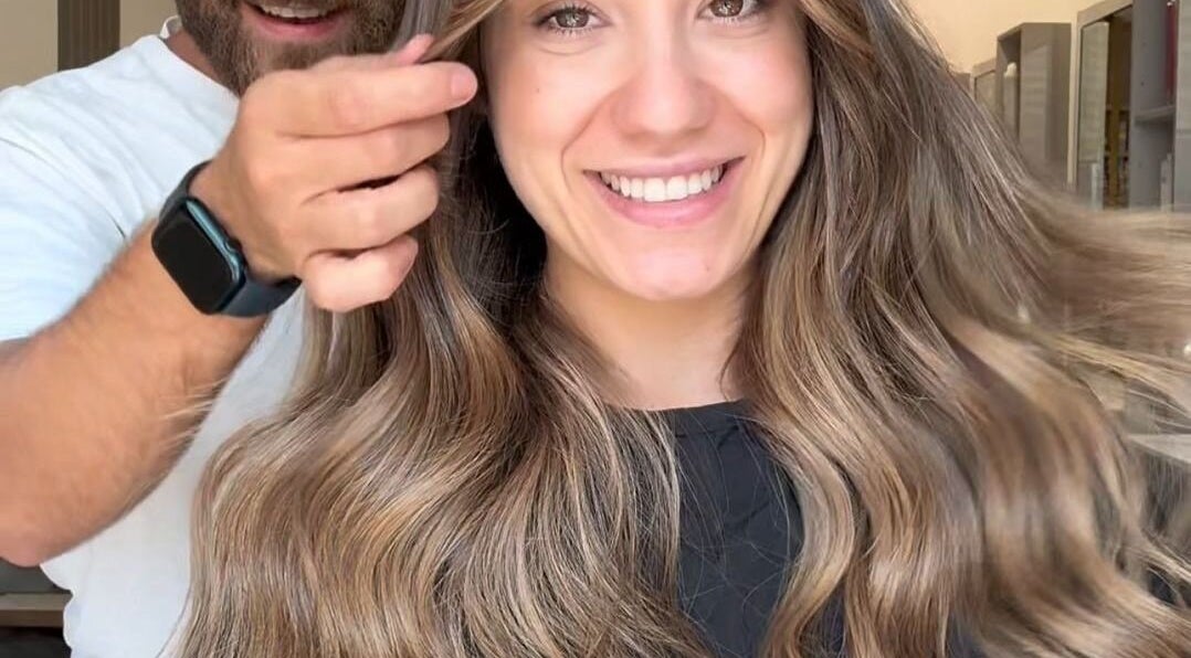 Stylist creating a wavy hairstyle at Salon Charles Malek in Naqqache, Jabal Lubnan, LB.