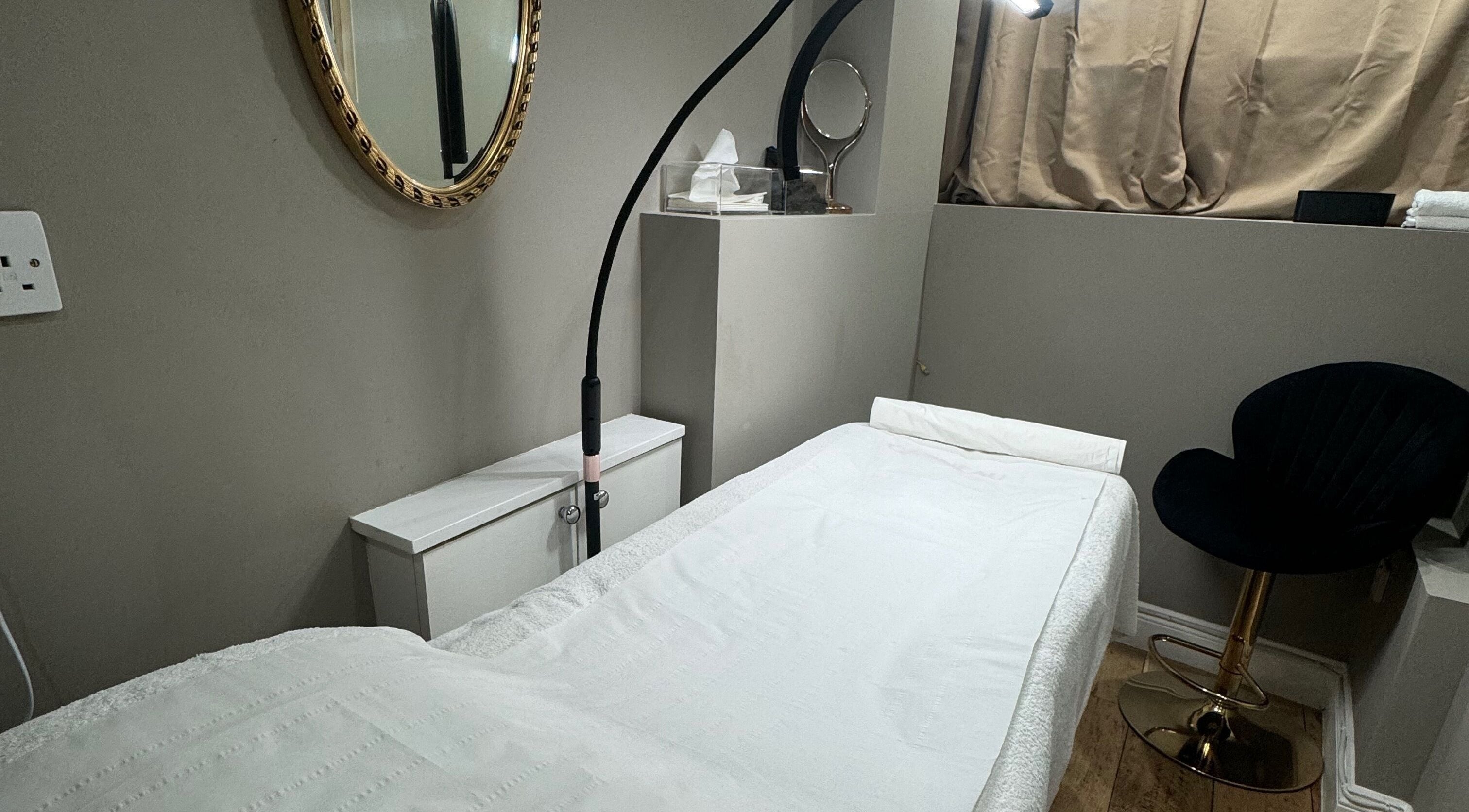 Tranquil treatment room at Masha Beauty Room in London, England, GB with a plush bed and modern decor.