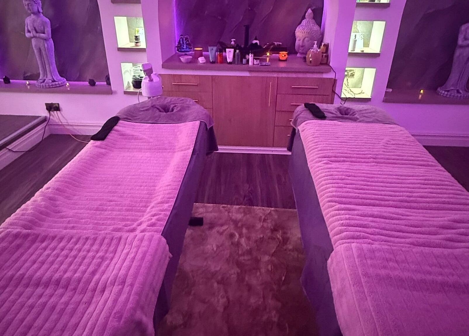 Relaxing massage setup at Eden Hair & Beauty in Heywood, England, GB with cozy lighting and decor.