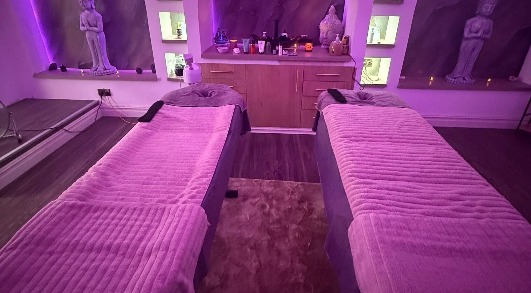 Relaxing massage setup at Eden Hair & Beauty in Heywood, England, GB with cozy lighting and decor.