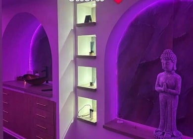 Relaxing purple-lit interior at Eden Hair & Beauty, Heywood, England, GB, showcasing serene modern decor.