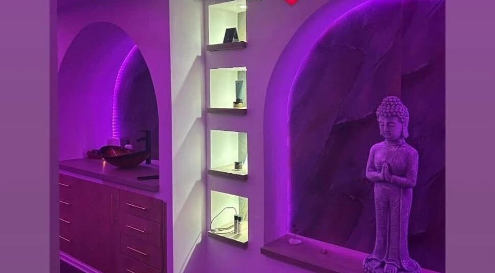 Relaxing purple-lit interior at Eden Hair & Beauty, Heywood, England, GB, showcasing serene modern decor.