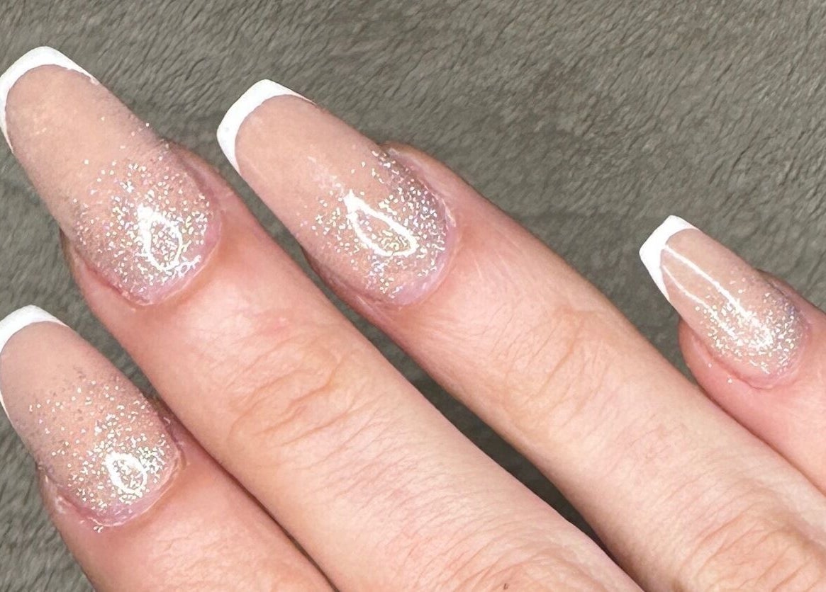 Glittery French manicure at Glow Nails, Dublin, County Dublin, IE featuring elegant and sparkling nail art.