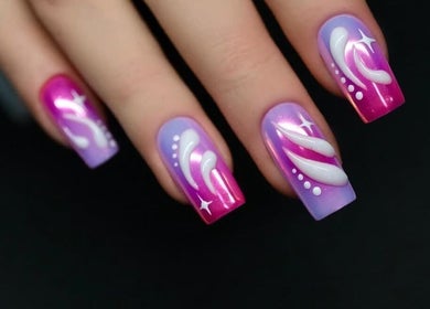 Vibrant purple and pink nail art at Shape Nails, Medford, Massachusetts, US showcasing intricate designs.