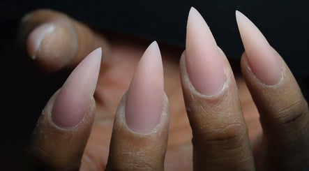 Close-up of elegant, sharp almond-shaped nails at Shape Nails, Medford, Massachusetts, US.