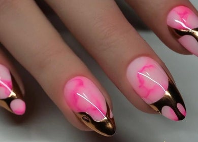 Stunning pink and gold nail art at Shape Nails located in Medford, Massachusetts, US.