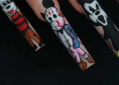 Creative nail art at Shape Nails in Medford, Massachusetts, US. Bold and colorful designs on long nails.
