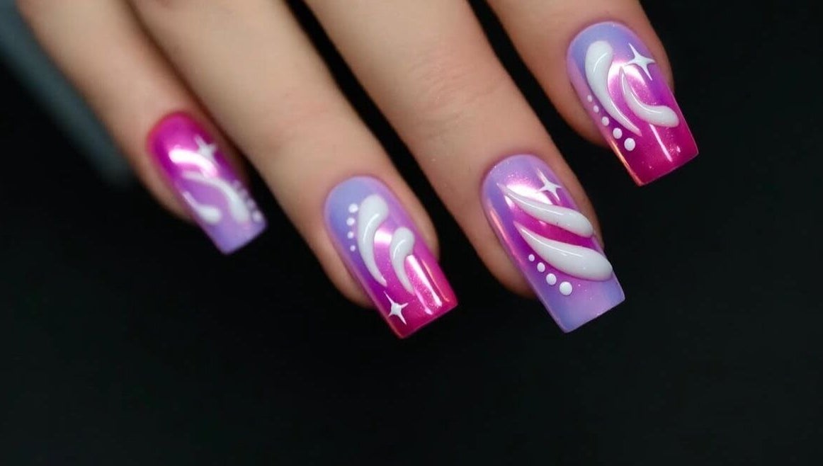 Intricate pink and purple nail art at Shape Nails Medford in Medford, Massachusetts, US.