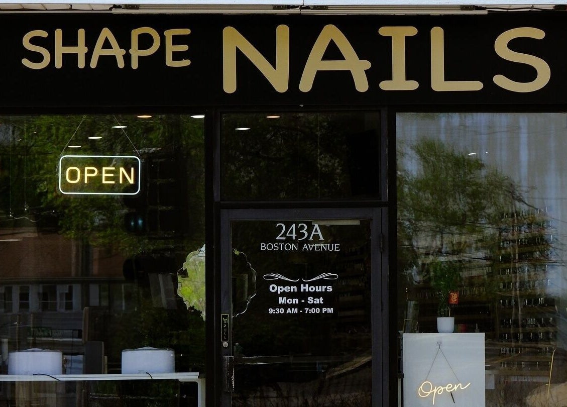Entrance of Shape Nails Medford on Boston Avenue, Medford, Massachusetts, US with open sign.