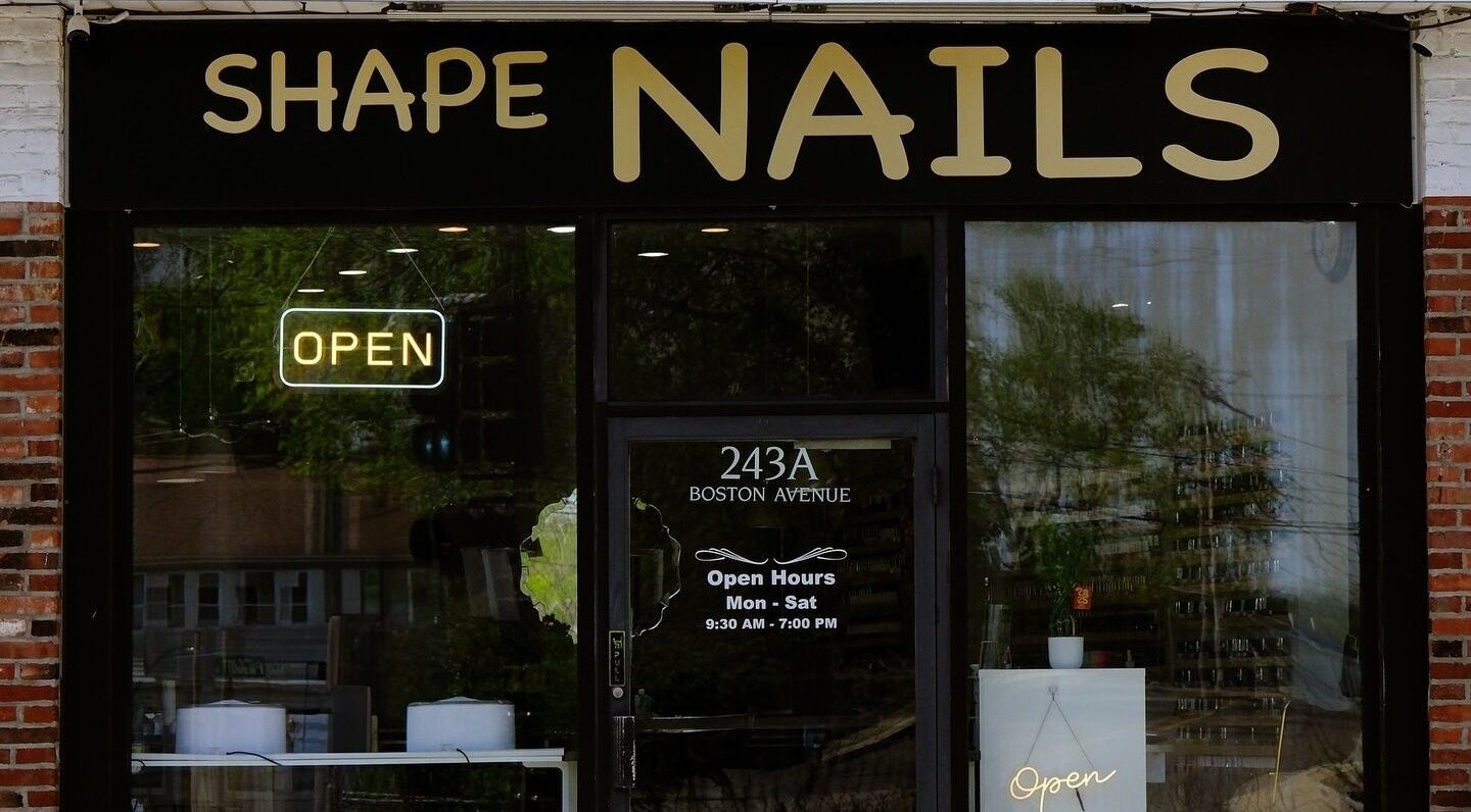 Entrance of Shape Nails Medford on Boston Avenue, Medford, Massachusetts, US with open sign.