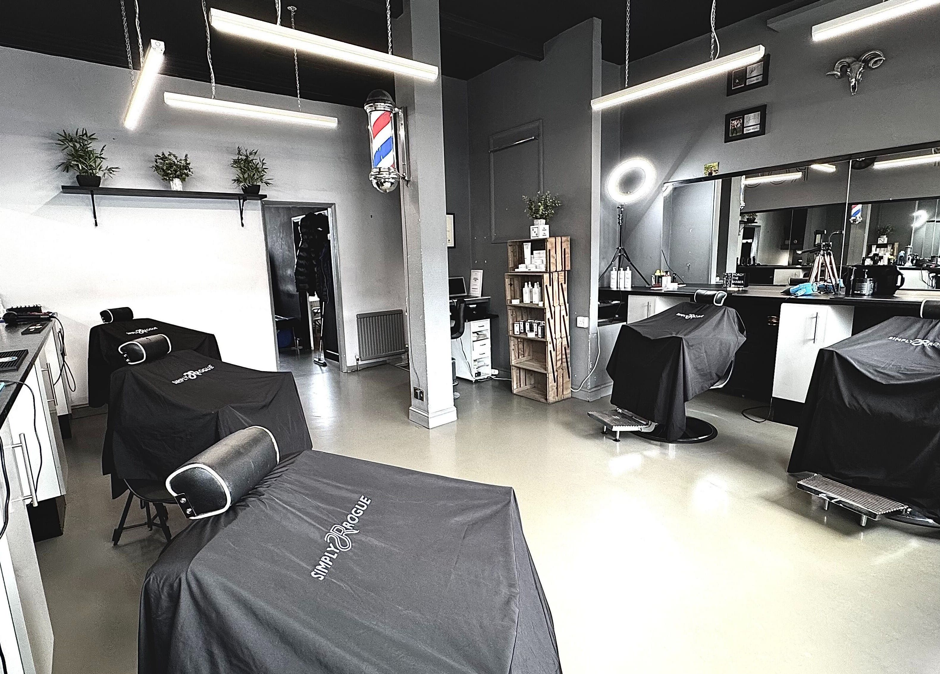 Interior of Simply Rogue salon, Darlington, England, showcasing modern barber chairs and classy decor.