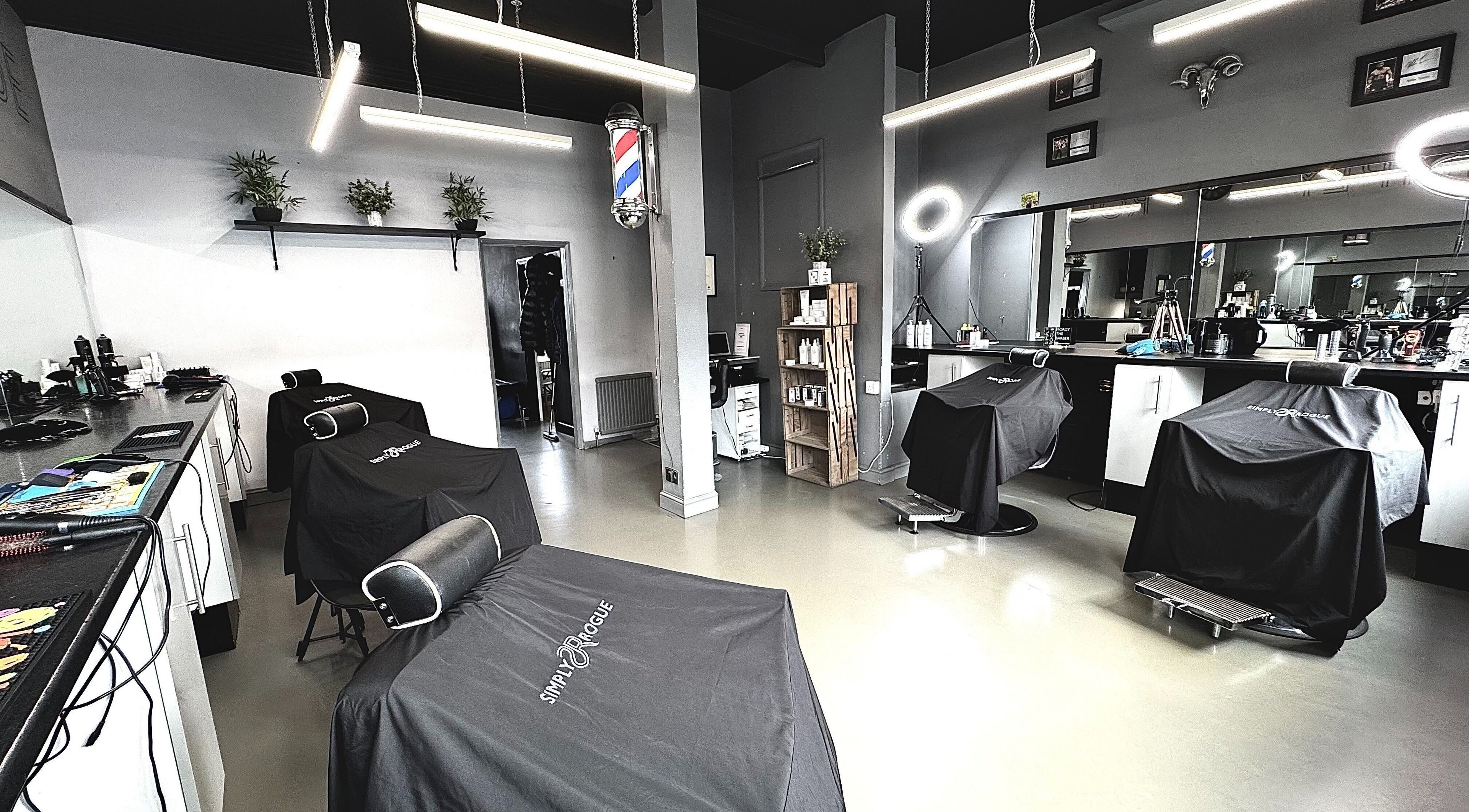 Interior of Simply Rogue salon, Darlington, England, showcasing modern barber chairs and classy decor.