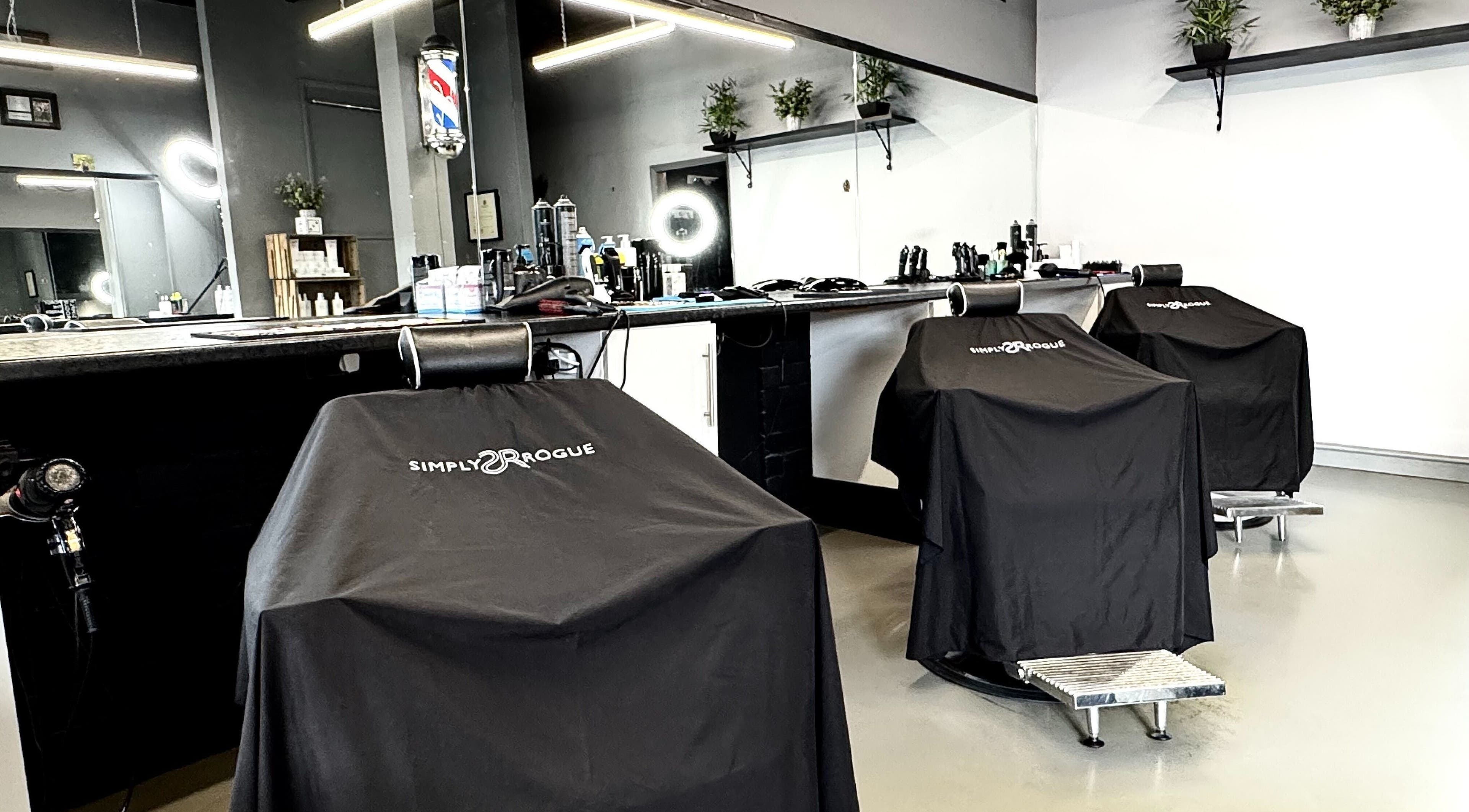 Modern salon chairs at Simply Rogue, Darlington, England, GB, showcasing stylish and inviting interior.