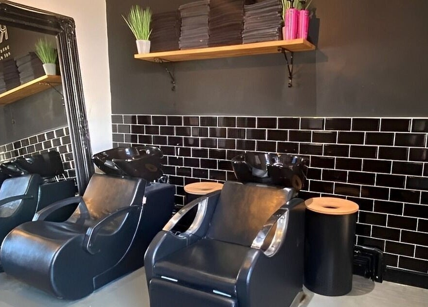 Stylish salon wash stations at Simply Rogue, Darlington, England, GB showcasing modern black design.