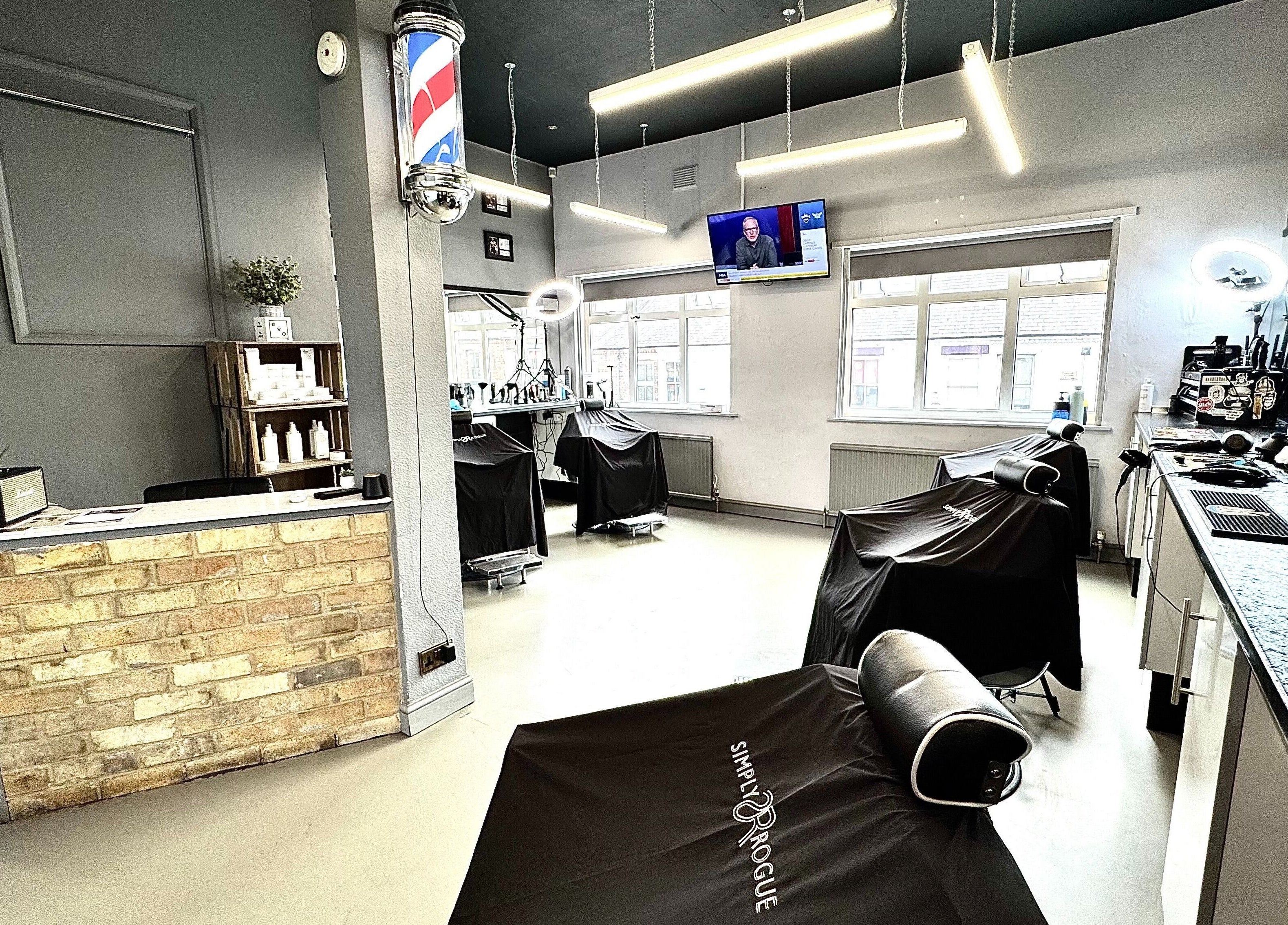 Simply Rogue salon in Darlington, England, GB showcases modern, stylish barber chairs and product displays.