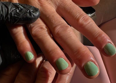 Mint green manicure at Aster Beauty, Fakenham, England, GB showcasing detailed nail art.