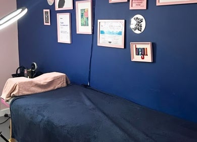 Treatment room at Alexander Beauty and Training Academy in Dreghorn, Scotland with decor and comfortable setup.
