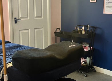 Spa room at Alexander Beauty and Training Academy in Dreghorn, Scotland, GB, with treatment bed and equipment.