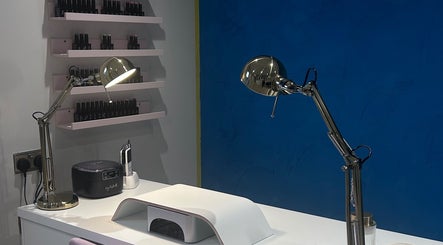 Modern nail care desk at Alexander Beauty and Training Academy, Irvine, Scotland, GB with elegant lighting.