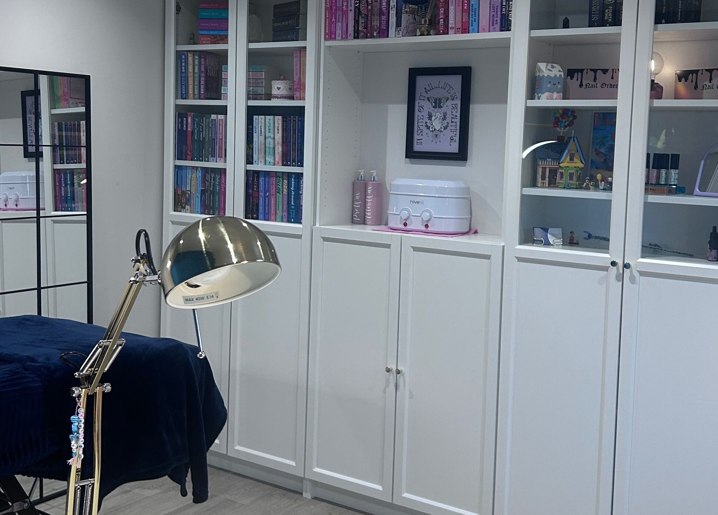 A serene beauty room at Alexander Beauty and Training Academy, Irvine, Scotland, GB, with elegant shelving.
