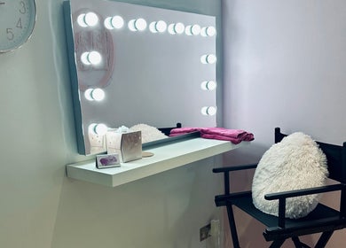 Lux by Kristina's elegant makeup area with mirror and lights in Cheltenham, England, GB.