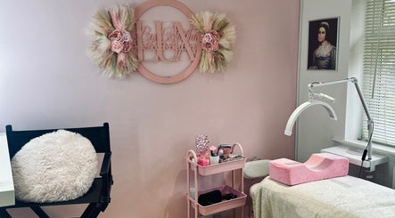 Lux by Kristina beauty corner in Cheltenham, England, GB with elegant decor and treatment setup.