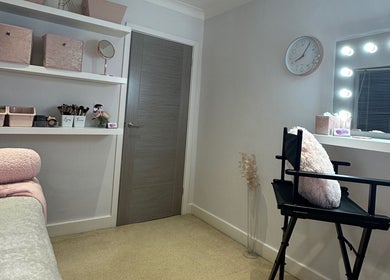 Lux by Kristina's cozy interior with makeup chair and soft pink accents in Cheltenham, England, GB.