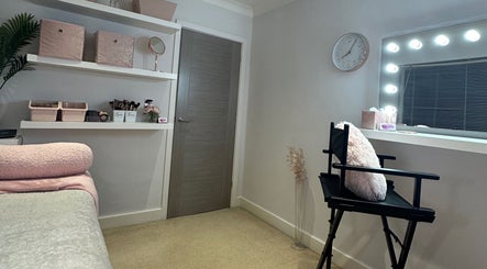 Lux by Kristina's cozy interior with makeup chair and soft pink accents in Cheltenham, England, GB.
