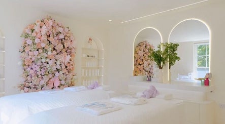Tranquil spa room with pastel floral wall at Ethereal Aesthetics, London, England, GB.