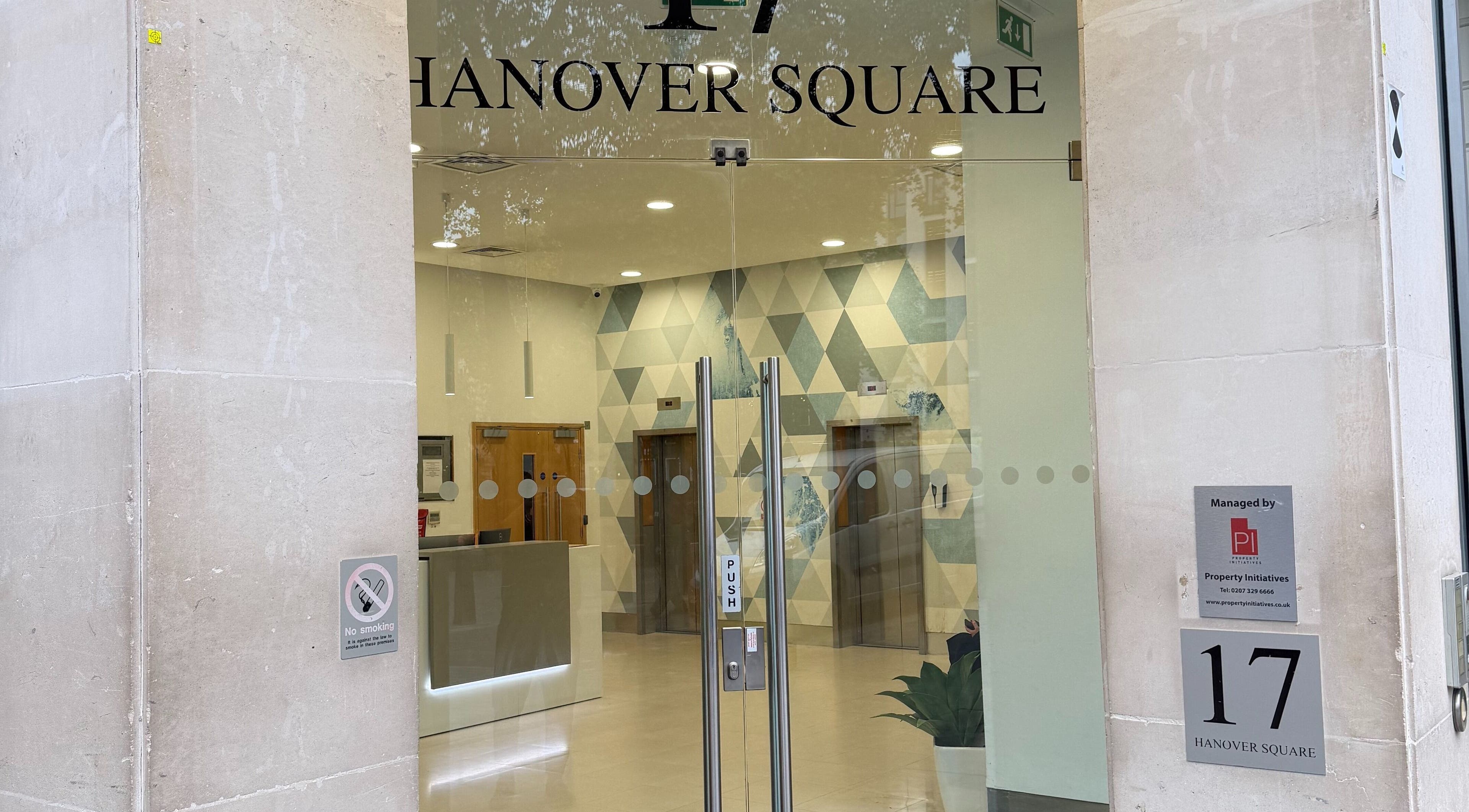 Entrance to Seventeen Physiotherapy Clinic in London, England, GB with glass doors and modern decor.