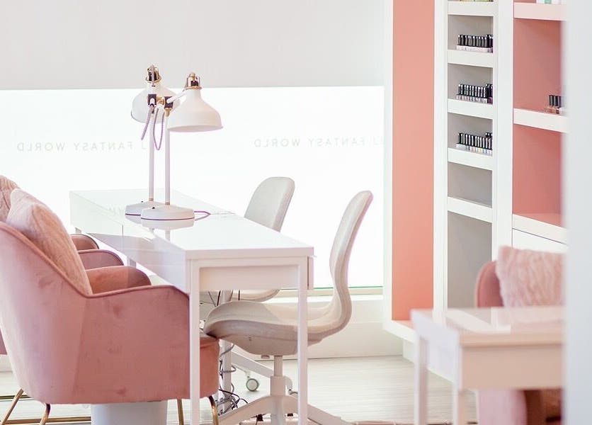 Chic beauty salon interior at JJ Fantasy World, Richmond, British Columbia, CA with pink accents and bright lighting.