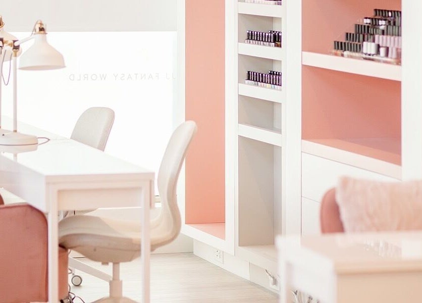 Modern salon at JJ Fantasy World in Richmond, British Columbia, CA with stylish seating and pink accents.