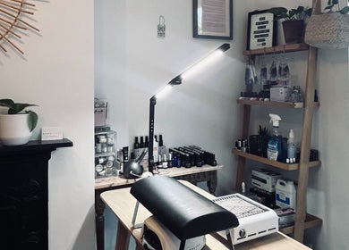 Modern nail station at Thenailshed, Hurstpierpoint, England, GB, with organized supplies and calming decor.