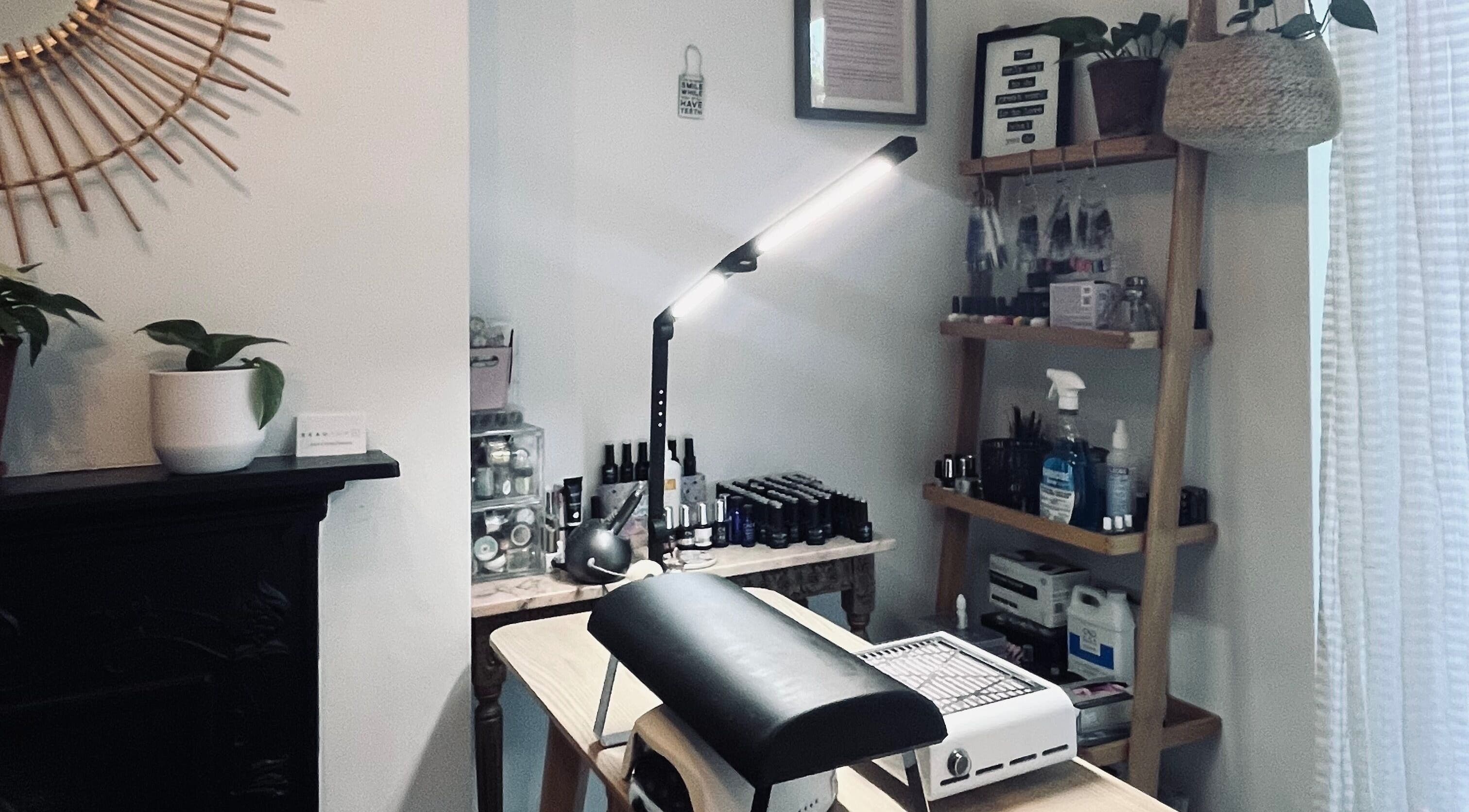 Modern nail station at Thenailshed, Hurstpierpoint, England, GB, with organized supplies and calming decor.