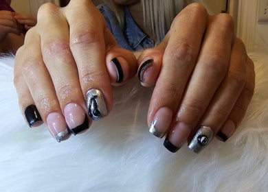 Stylish black and silver nail art at Khloes Beauty Room, Belfast, Northern Ireland, GB.