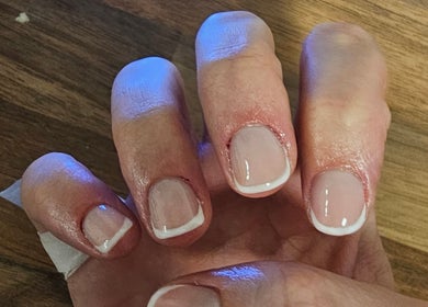 French manicure at Khloes Beauty Room in Belfast, Northern Ireland, GB showcasing elegant nail art.