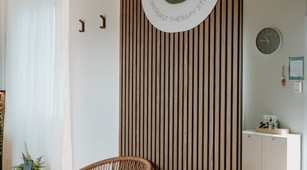 Calm and inviting lounge area in Recovery Lane, Waiuku, Auckland, NZ with wooden accents and relaxing atmosphere.