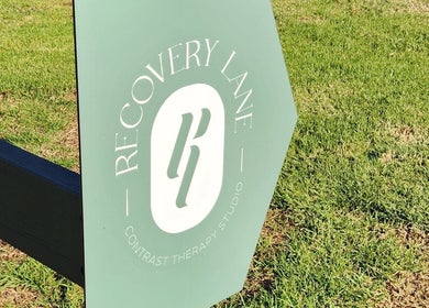 Recovery Lane sign on green grass in Waiuku, Auckland, NZ.