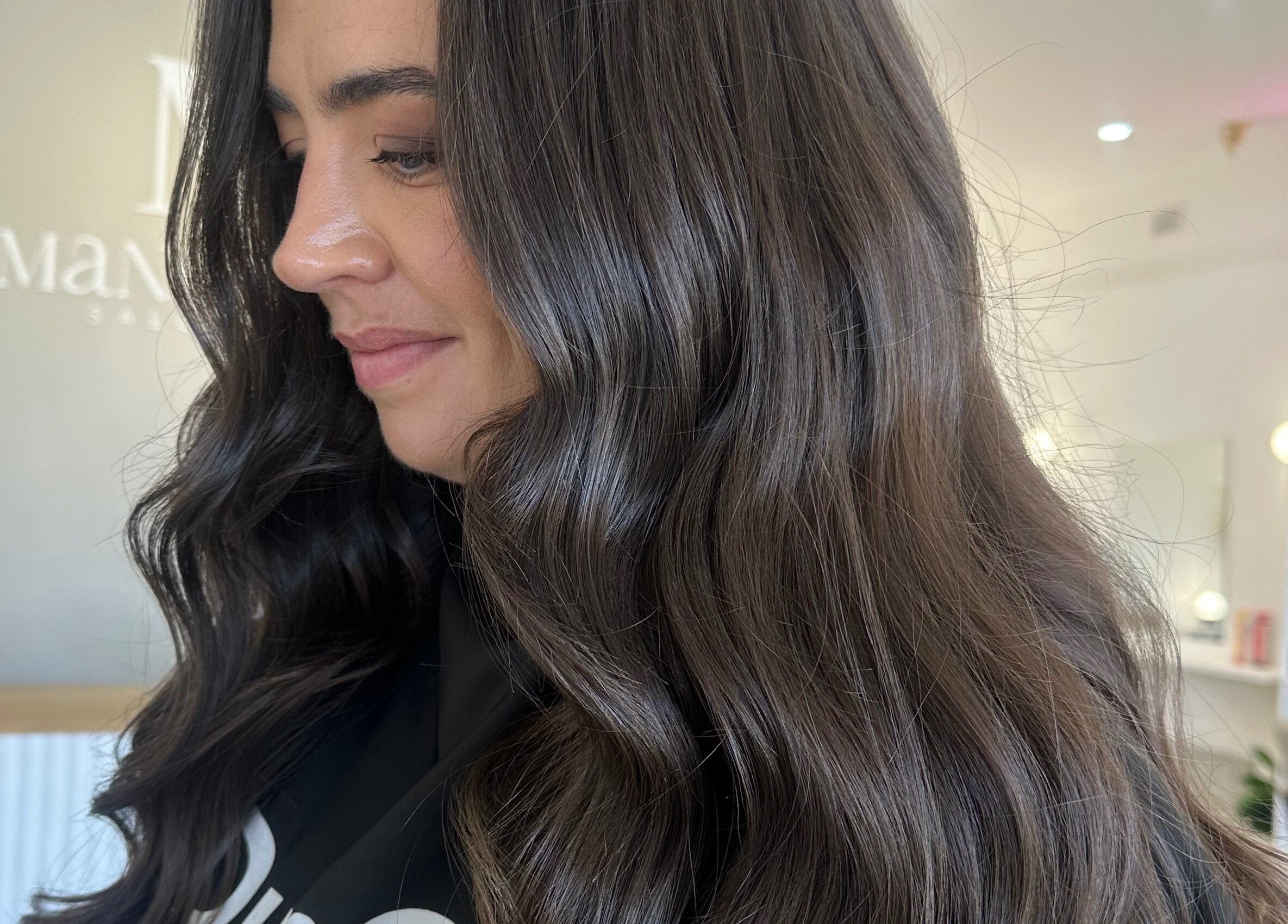 Styled By Maddie in Ethelton, South Australia, AU provides stunning brunette curls in a chic salon environment.