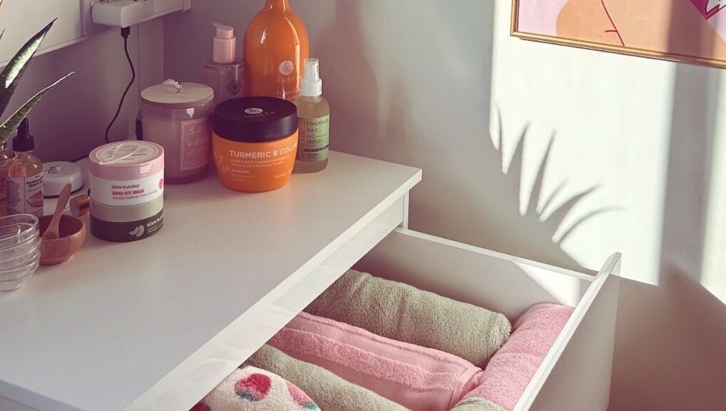 Vibes Head Spa in Birkenhead, England: A calming display of beauty products and towels in natural light.