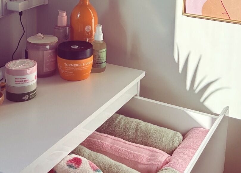 Vibes Head Spa in Birkenhead, England: A calming display of beauty products and towels in natural light.